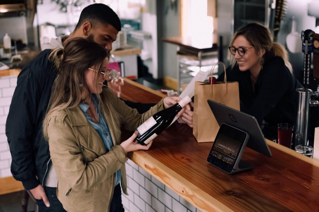 A couple buying wine at a wine shop
