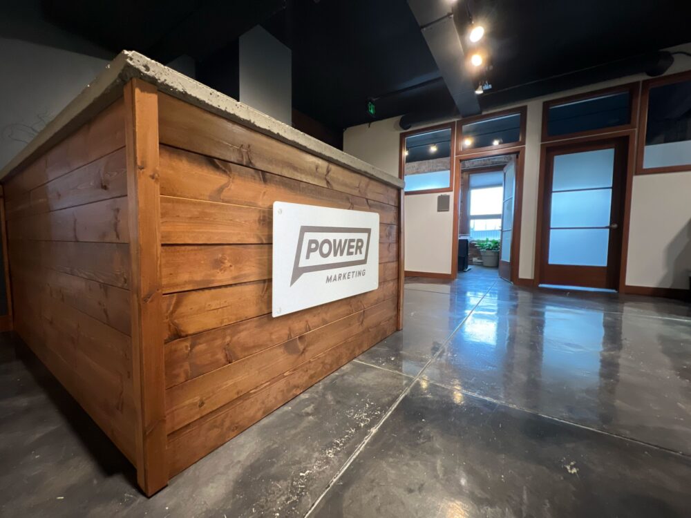 Photo of wall with Power Marketing logo